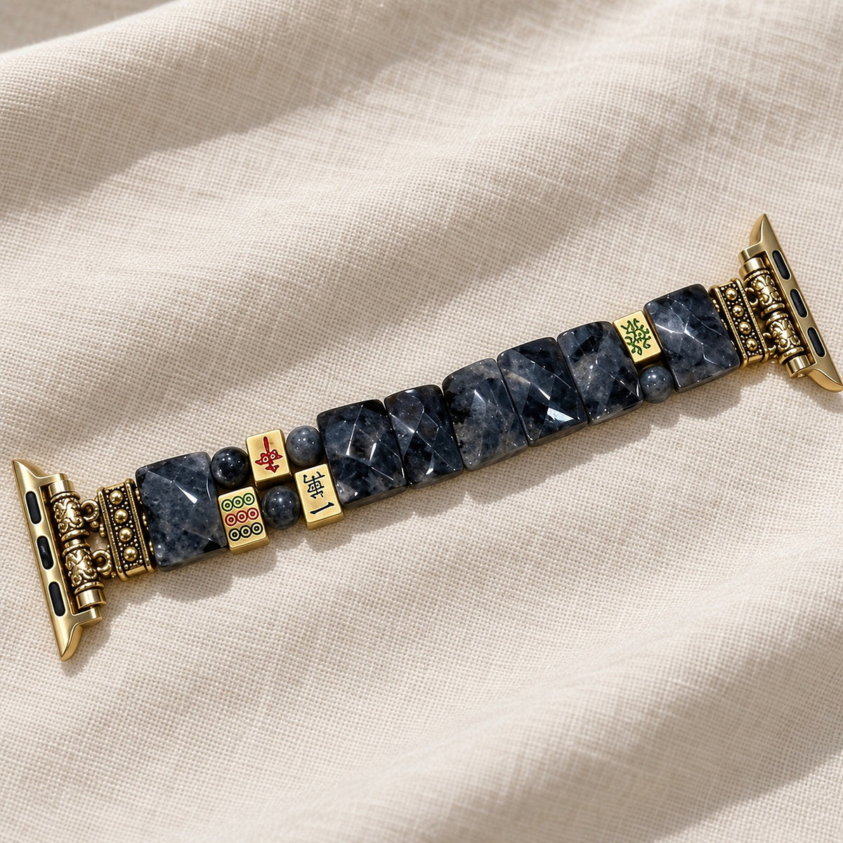 Midnight Fortune mahjong Apple Watch strap laid flat on linen